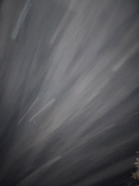 a blurry image of a star streaking across the sky